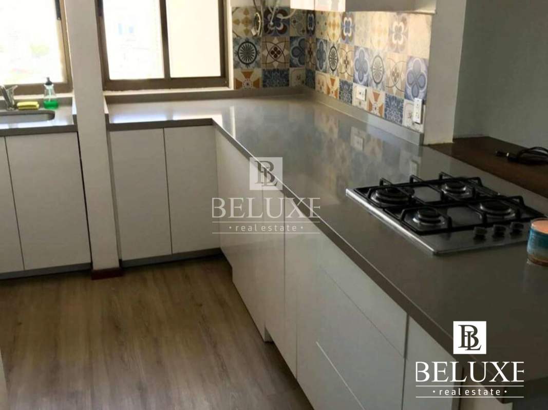 Open living and dining area leading to balcony with skyline views in PH Pacific Wind Panama