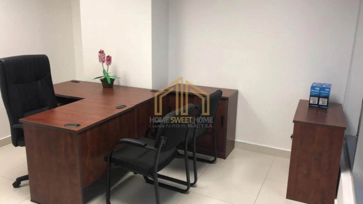 Compact private office space furnished with wood desk and chairs in Tower Banesco, Ocean Business Plaza