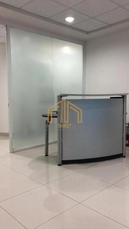 Minimalist office reception with curved desk in Ocean Business Plaza Tower Banesco