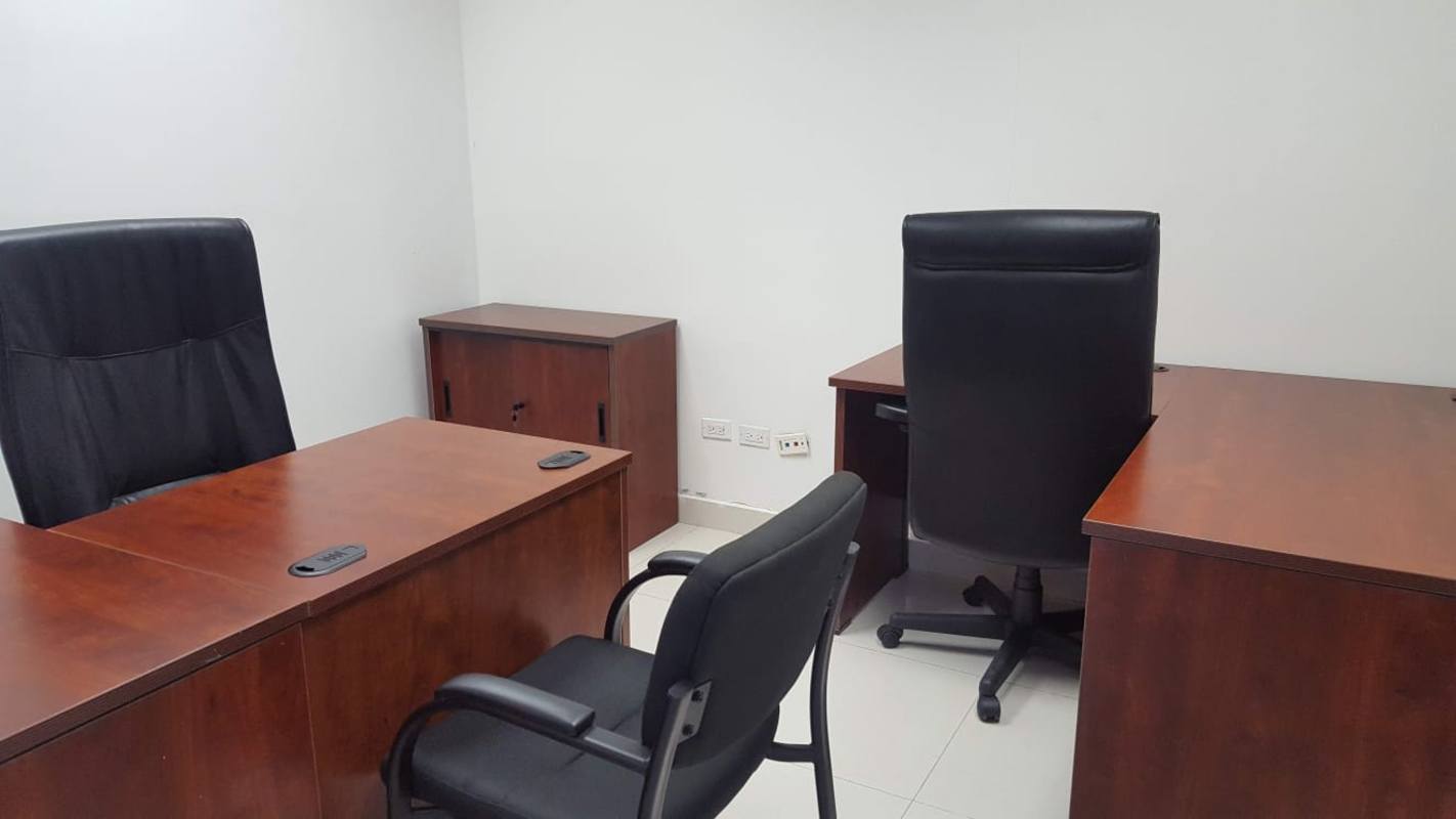 Open cubicle area with desks and office chairs in Ocean Business Plaza Marbella