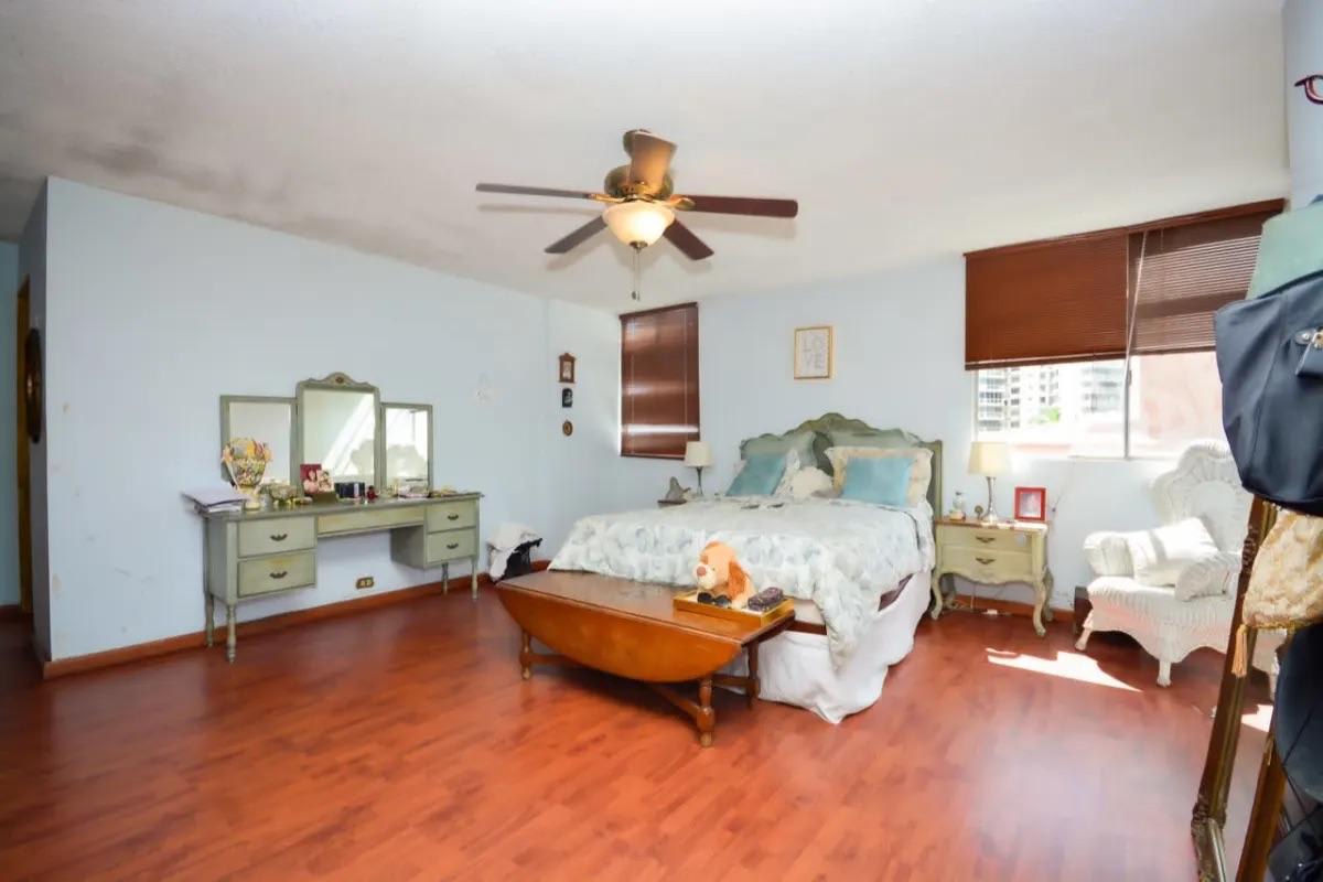 Formal dining room with city view balcony access in PH Alamar Panama City