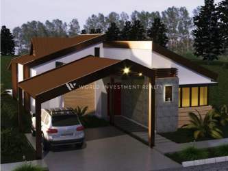 Tree-lined cobblestone park path with benches and landscaping in Terra Viva Coronado beach community