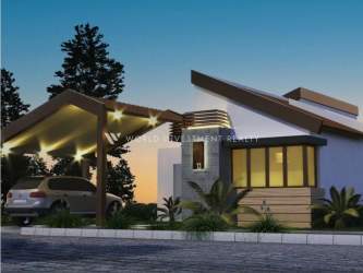 Main gated security entrance of Terra Viva community with lush trees and cobblestone driveway