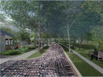 Main entrance gate with lush landscaping in Terra Viva Coronado residential development