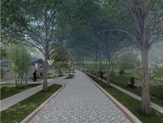 Cobbled tree-lined pedestrian path with benches and greenery Terra Viva Coronado community park