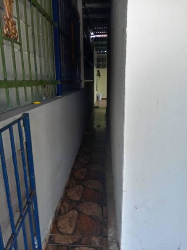 Exterior corridor with metal bars and tiled floor in Tocumen property