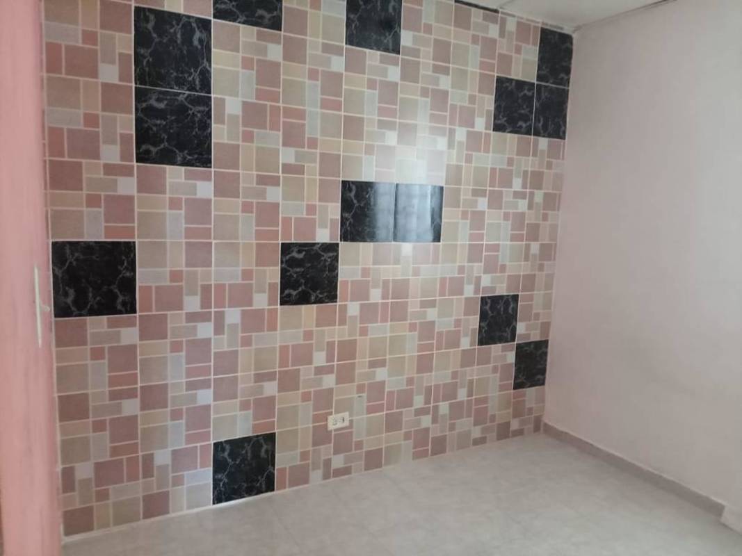 Covered outdoor patio with tiled raised platform Parque Santa Lucia home Tocumen