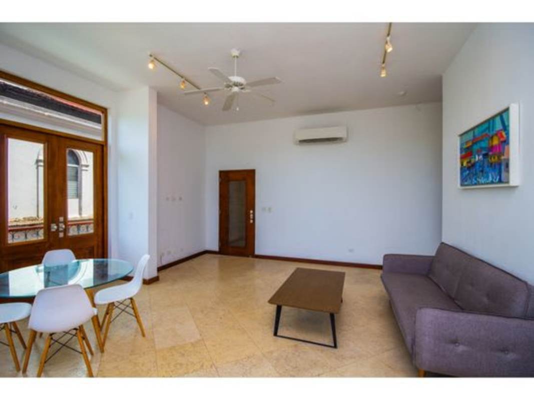 Modern galley kitchen with granite countertops in PH Puerta de Mar Casco Viejo