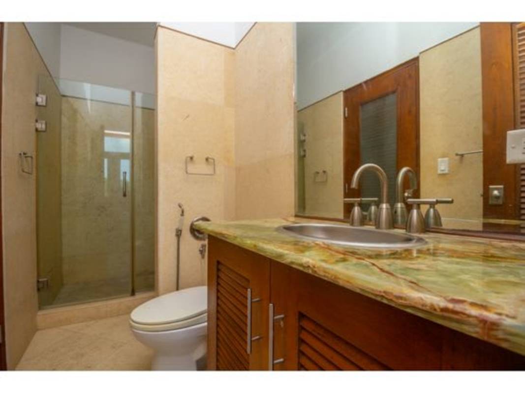 Bathroom with glass enclosed shower granite sink in PH Puerta de Mar Casco Viejo