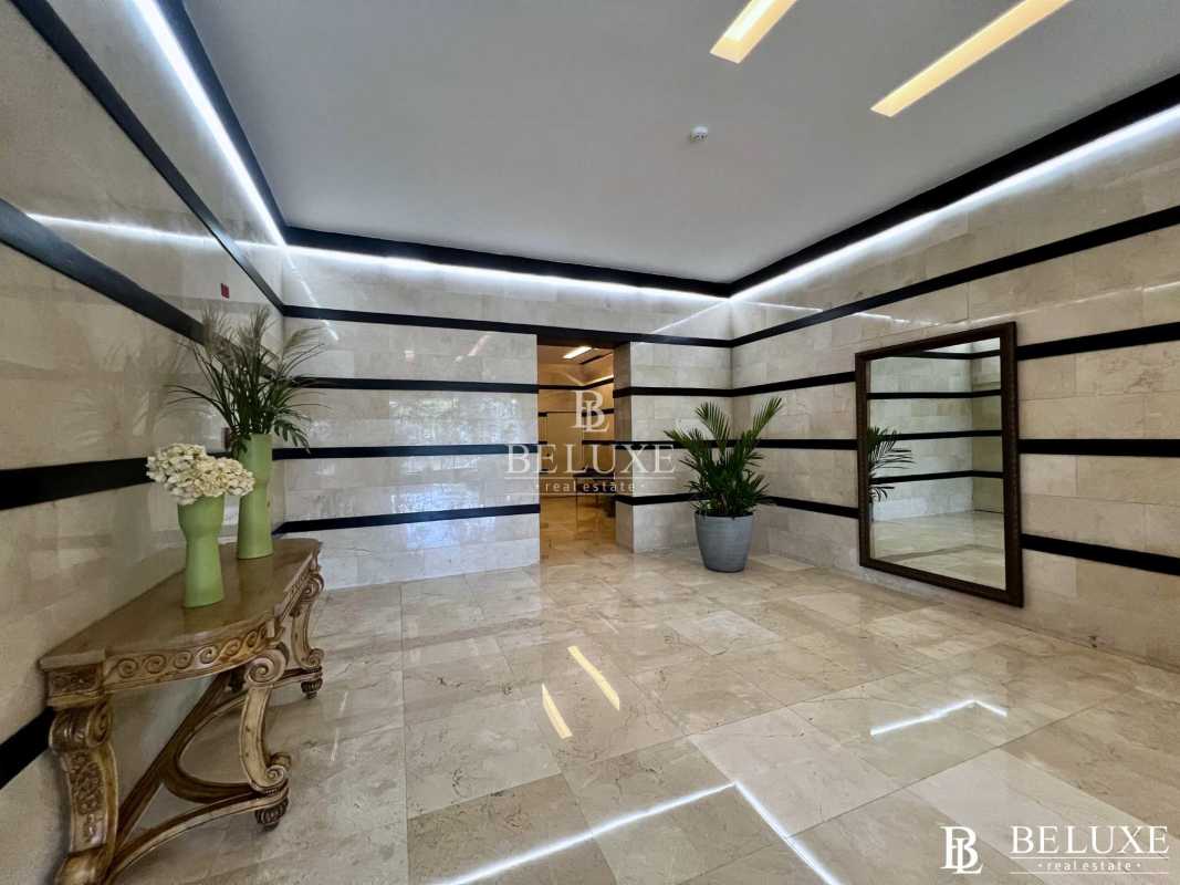 Luxury condominium lobby with marble walls and modern design PH Princesa Condesa del Mar Panama City