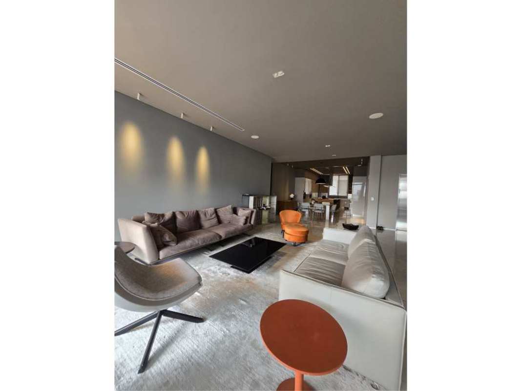 Contemporary living space with full height windows and terrace access Ocean Reef Islands