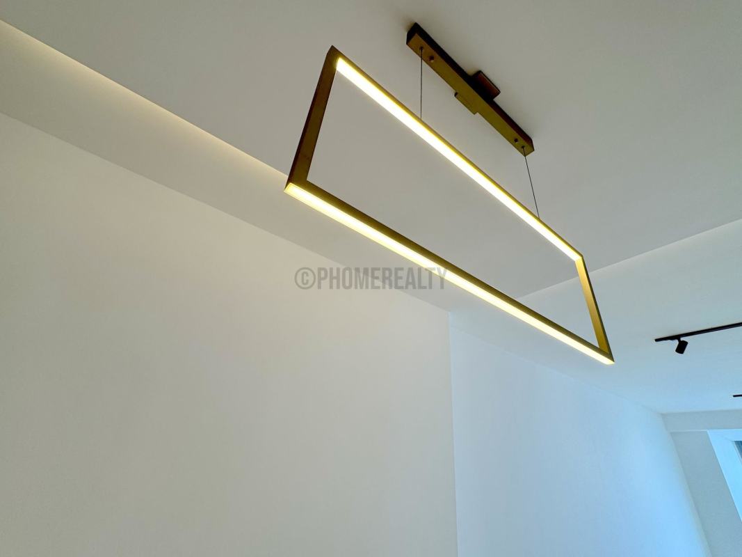 Minimalist dining space with marble floors and pendant lighting in luxury PH Yoo & Arts apartment Panama