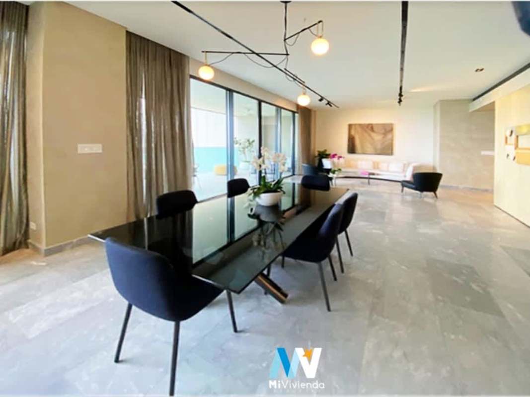 Luxury open-plan kitchen and dining with glass doors to balcony Costa del Este