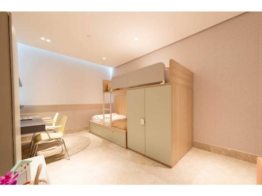 Spacious living room with marble floors, contemporary design and ocean-city skyline views in PH La Costanera Panama