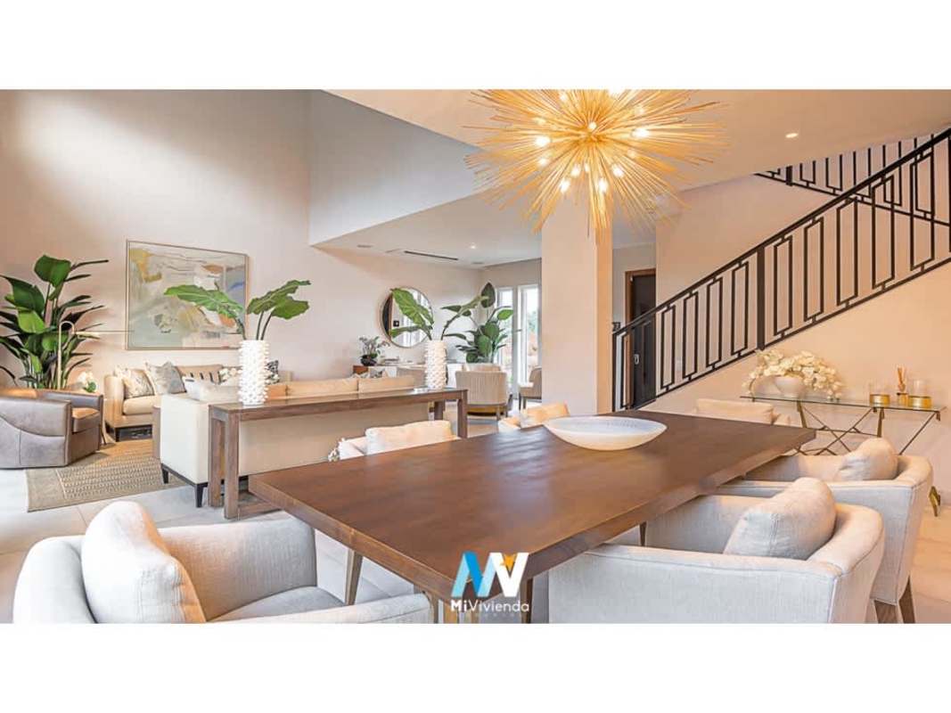 Luxurious open living dining area double-height ceiling duplex The Woods Santa Maria Panama