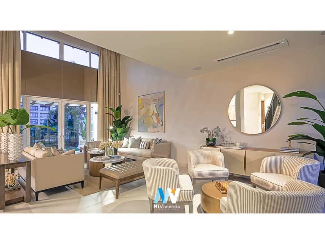 Modern master bedroom with large window overlooking Santa Maria Panama in The Woods