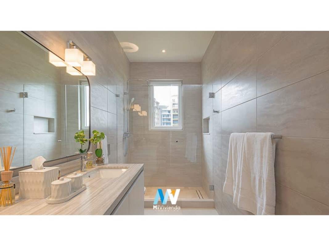 Luxury bathroom with glass shower, large mirror, natural light duplex villa The Woods