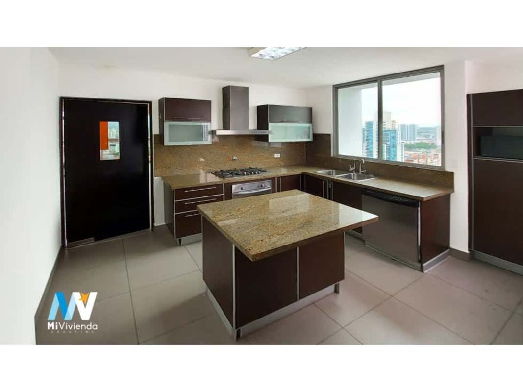 Spacious modern kitchen with granite island, appliances, large window with city view