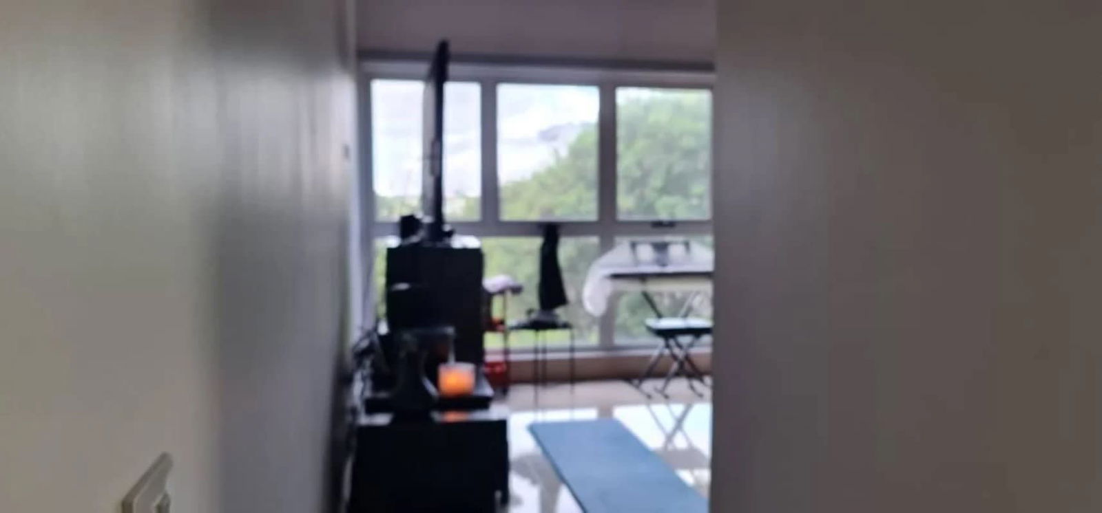 Elegant master bedroom with large windows overlooking garden Ocean House Panama