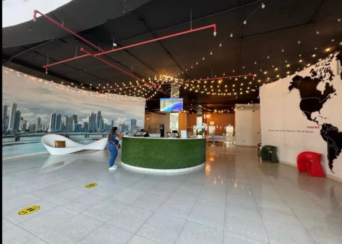 Living and dining area with expansive windows ocean views PH Bay View Panama City