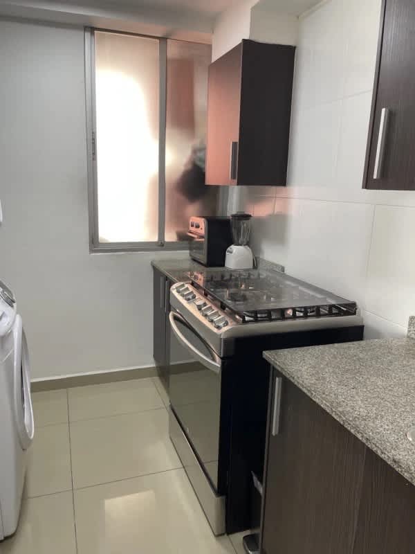 Secondary bedroom with blackout roller shades, AC unit, closet at PH Sky Park Panama City