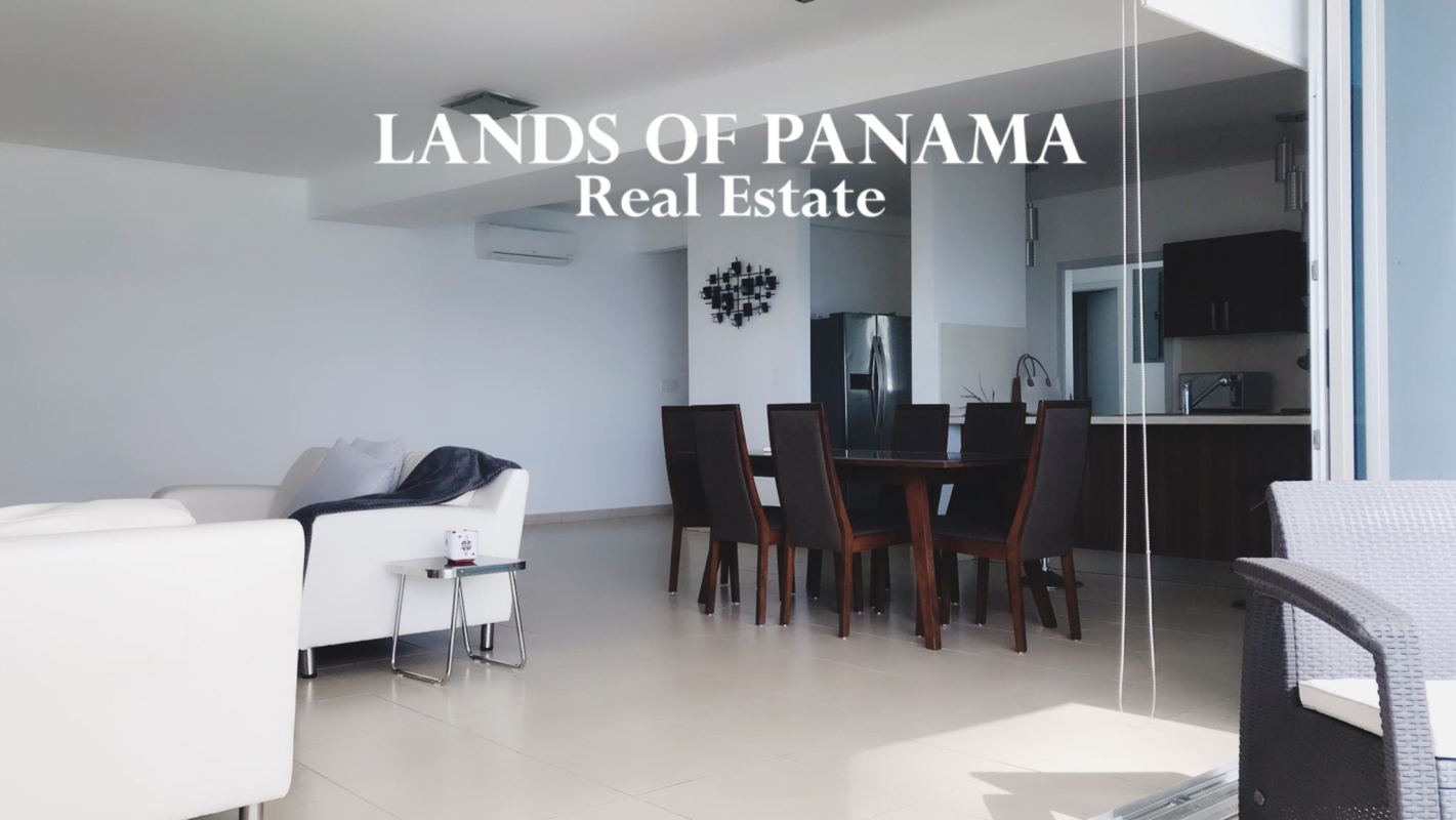 Spacious open plan living dining with floor-to-ceiling ocean view windows, porcelain floors in PH Oasis