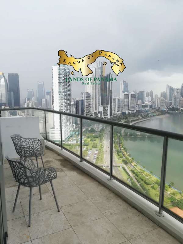 Glass-paneled terrace offering panoramic views over Pacific Ocean and Panama skyline