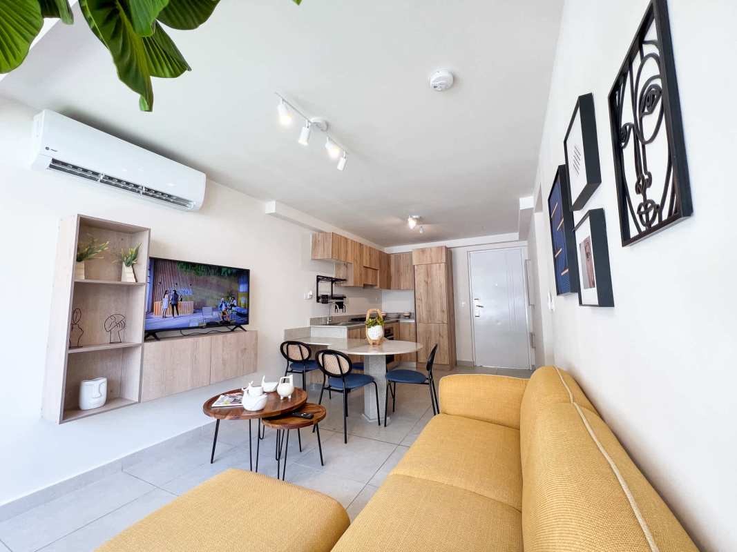 Contemporary kitchen and dining space inside Costana Residences Bella Vista Panama City