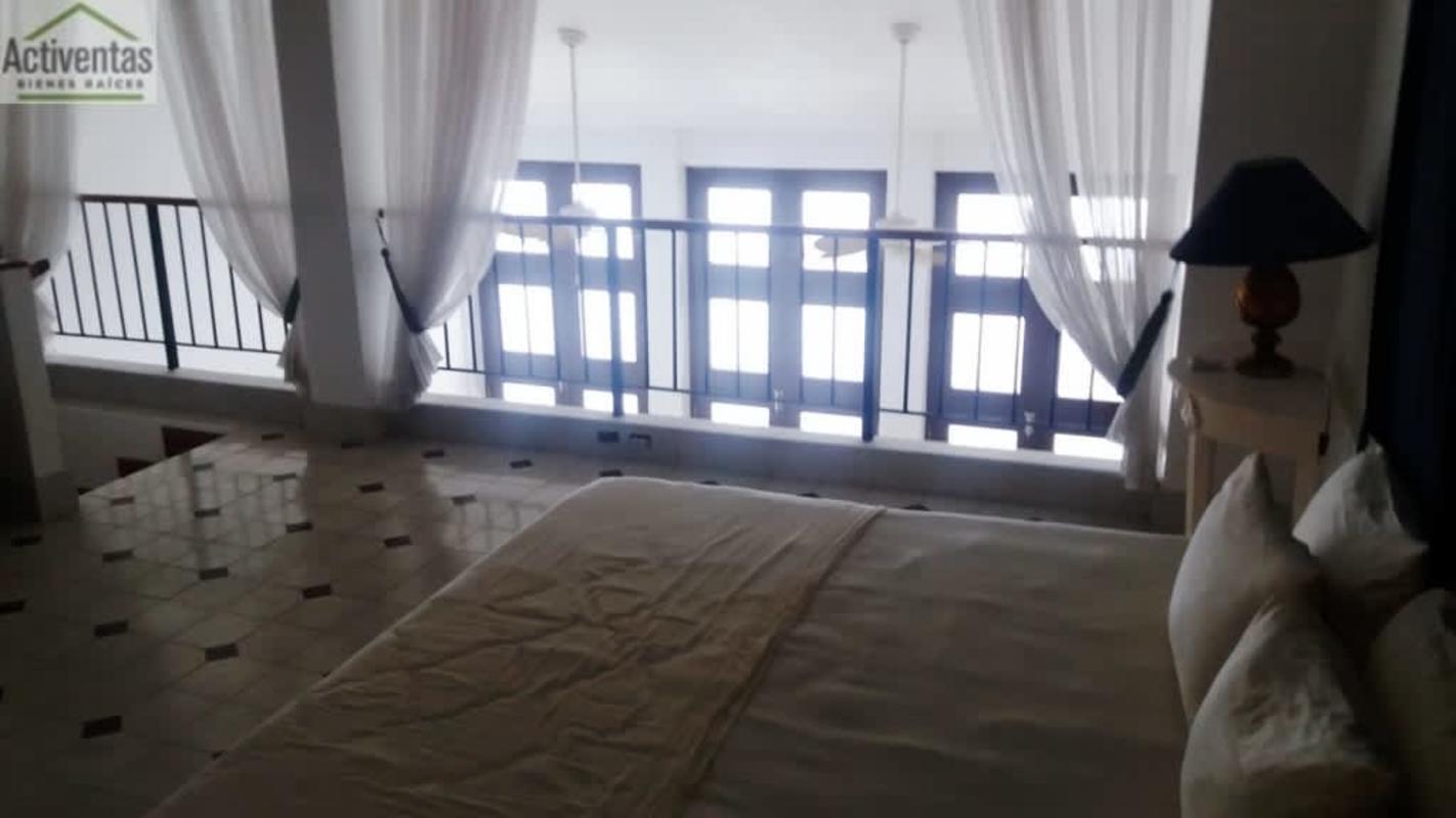 Spacious loft bedroom with large windows, tiled floors, in Casco Viejo Panama City