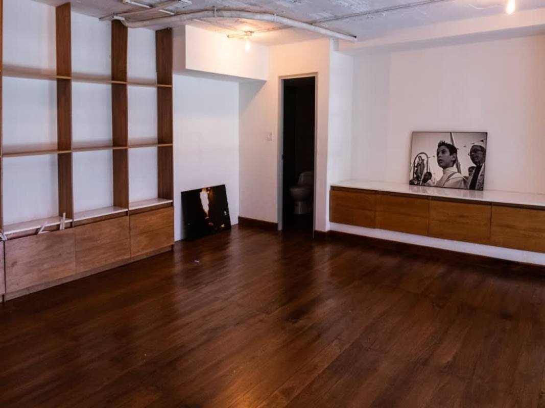 Minimalist living room wood floors built-in shelves colonial Casco Viejo Panama apartment sale