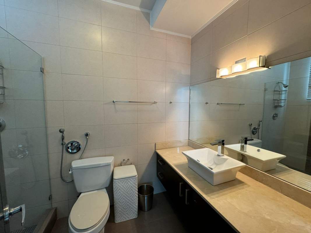 Elegant bathroom with glass enclosure, modern fixtures at PH Park One Altos del Golf Panama