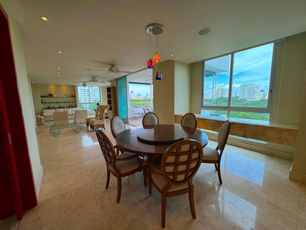 Open concept modern apartment interior with city and park view at PH Park One Altos del Golf Panama City
