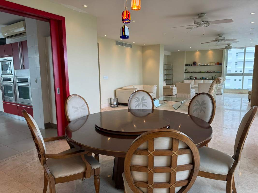 Open dining area with modern finishes, large window city views PH Park One Altos del Golf Panama