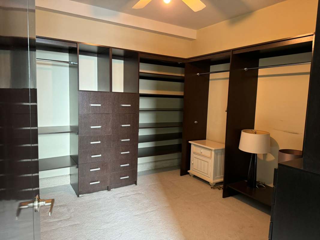Spacious custom walk-in closet with built-in shelves PH Park One Altos del Golf Panama