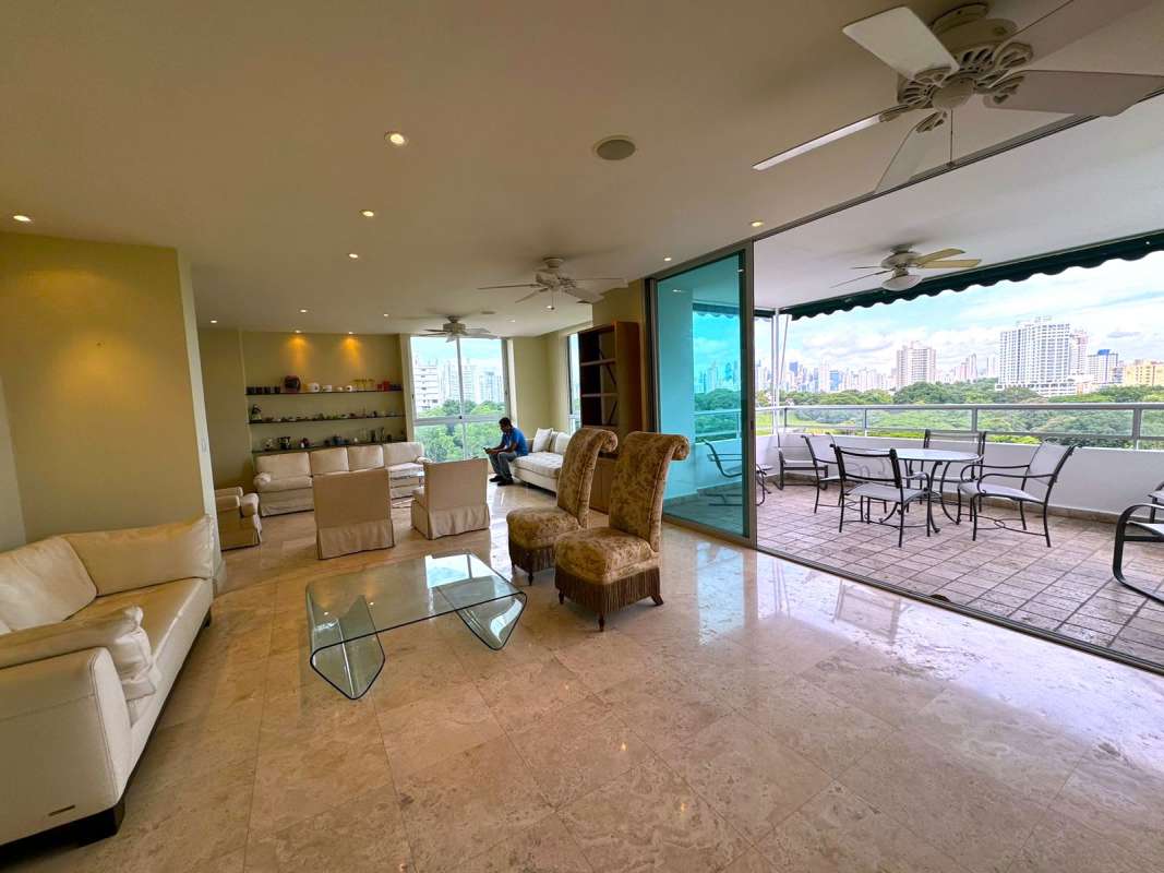 Bright open plan dining and living room with marble floors in PH Park One Panama City