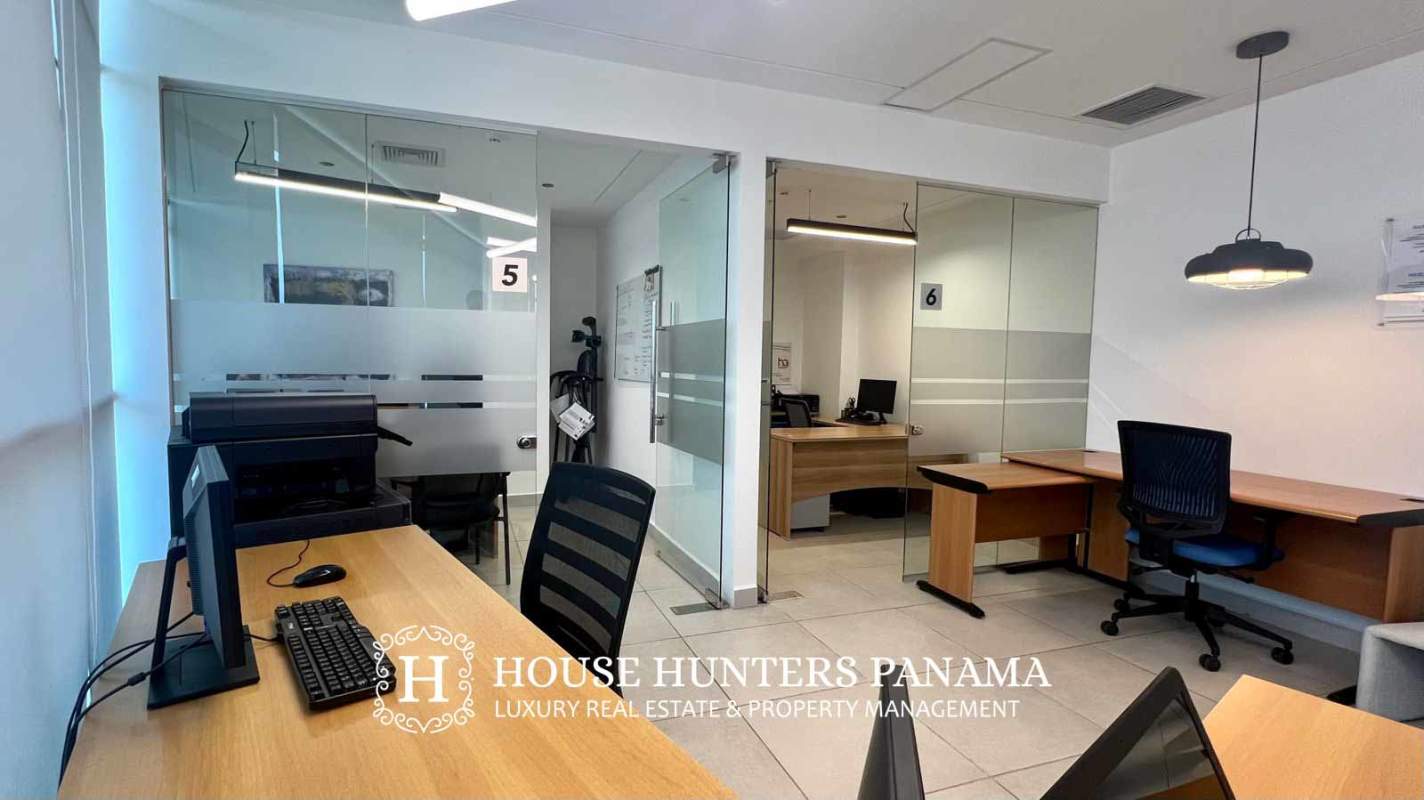 Bright office with blinds, modern furniture and city skyline view El Dorado Tower Panama