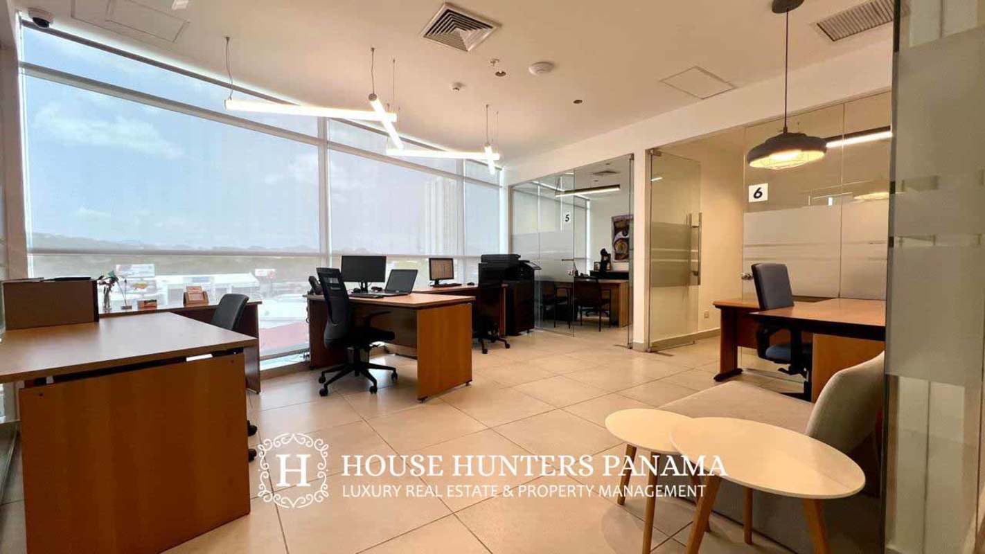 Open plan office with glass partitions and floor-to-ceiling windows El Dorado Tower