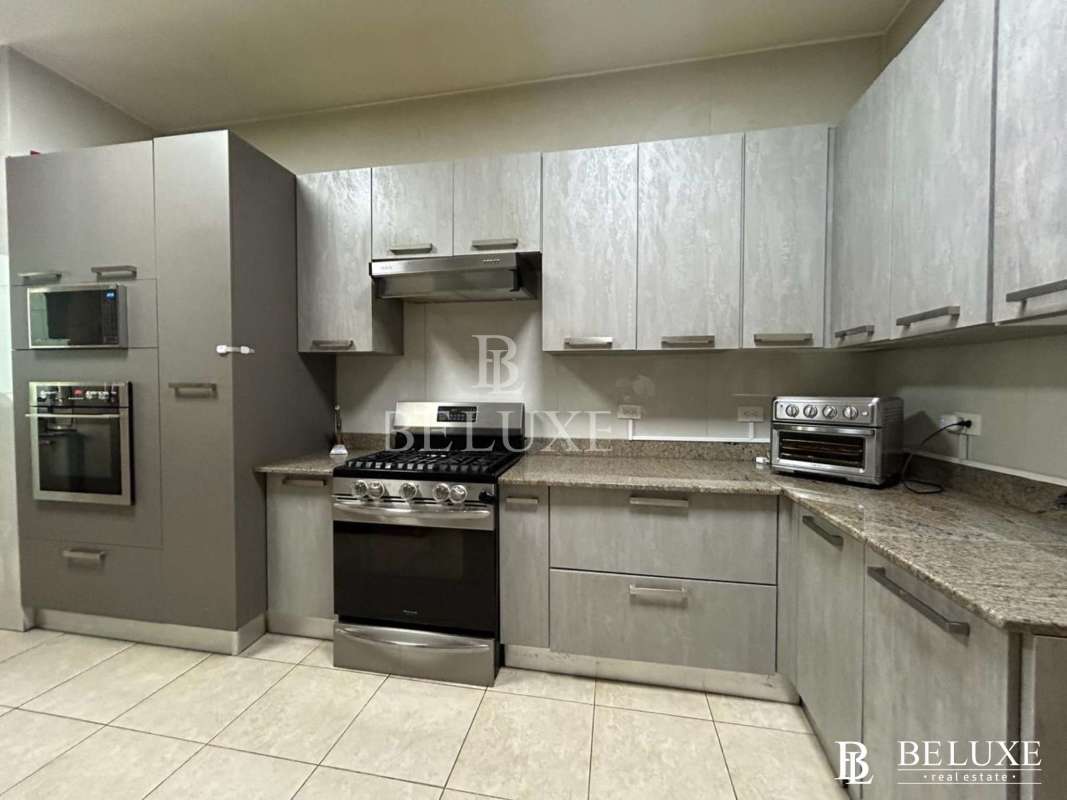 Modern bathroom with glass shower, marble finishes, double sink PH Pacific Village Punta Pacifica Panama