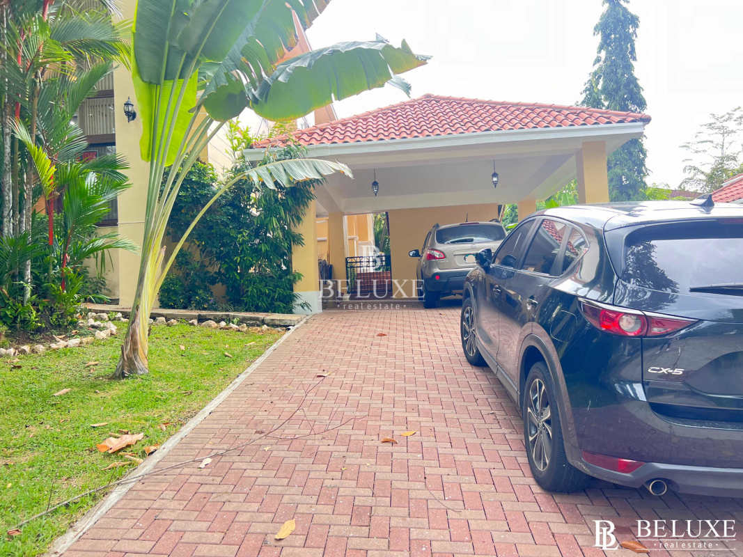 Mediterranean tropical house facade with lush landscaping and balcony Camino de Cruces Panama