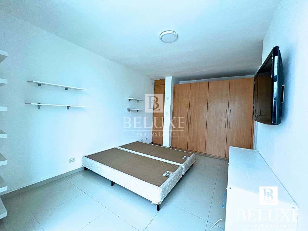 Modern bedroom with AC and built-in closet in Costa Sur Panama house for sale or rent