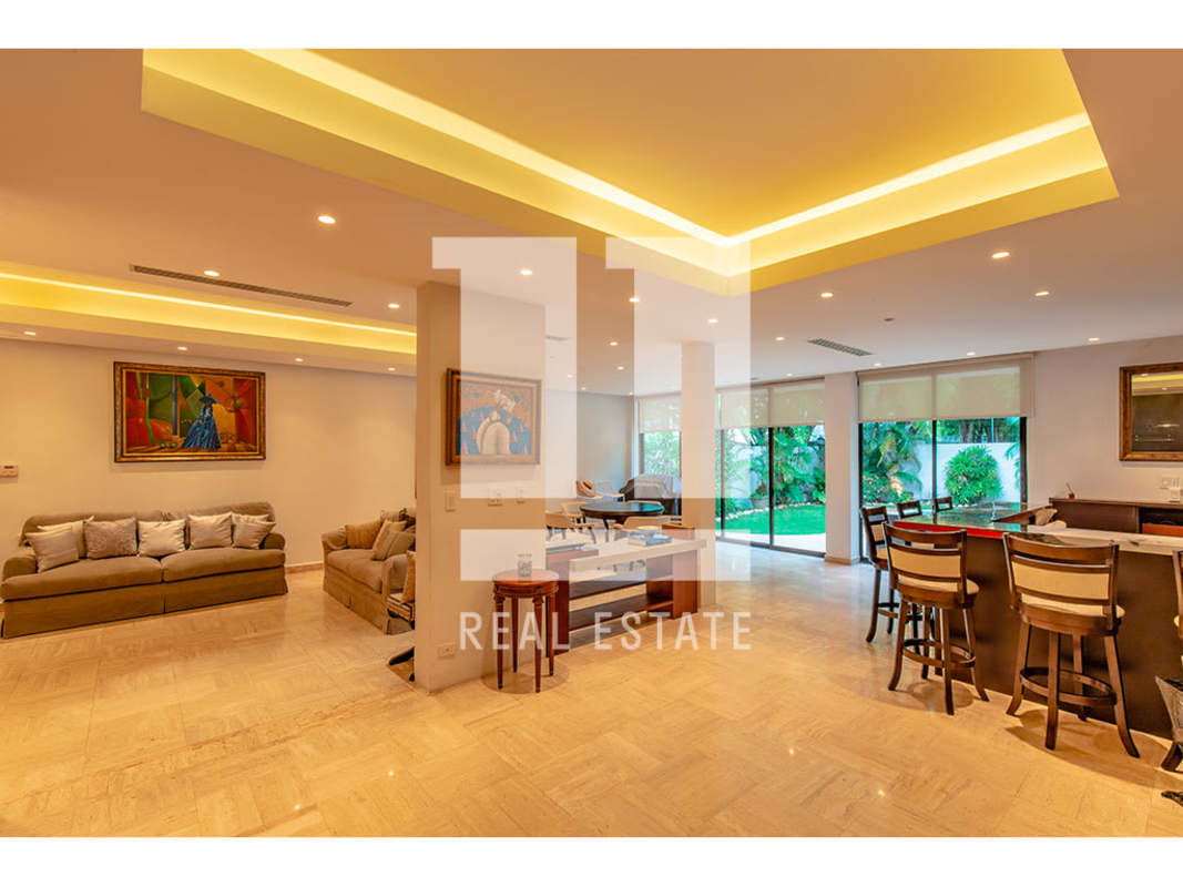 Bright kitchen with granite countertops and breakfast bar in house for sale Obarrio Panama