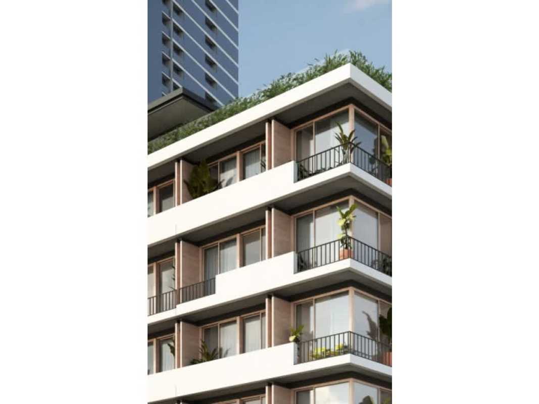 Skyline rooftop infinity pool with lush landscaping at PH Nook Panama City