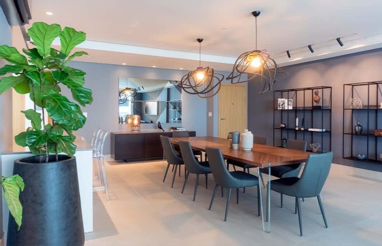 Contemporary dining room with large windows and city views at Murano Tower Coco del Mar