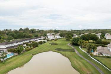 Drone view of Bijao Beach Club with golf course, beach access and private homes in Río Hato Panama