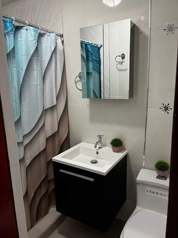 Modern kitchenette granite countertop microwave refrigerator in studio El Dorado Villa de las Fuentes