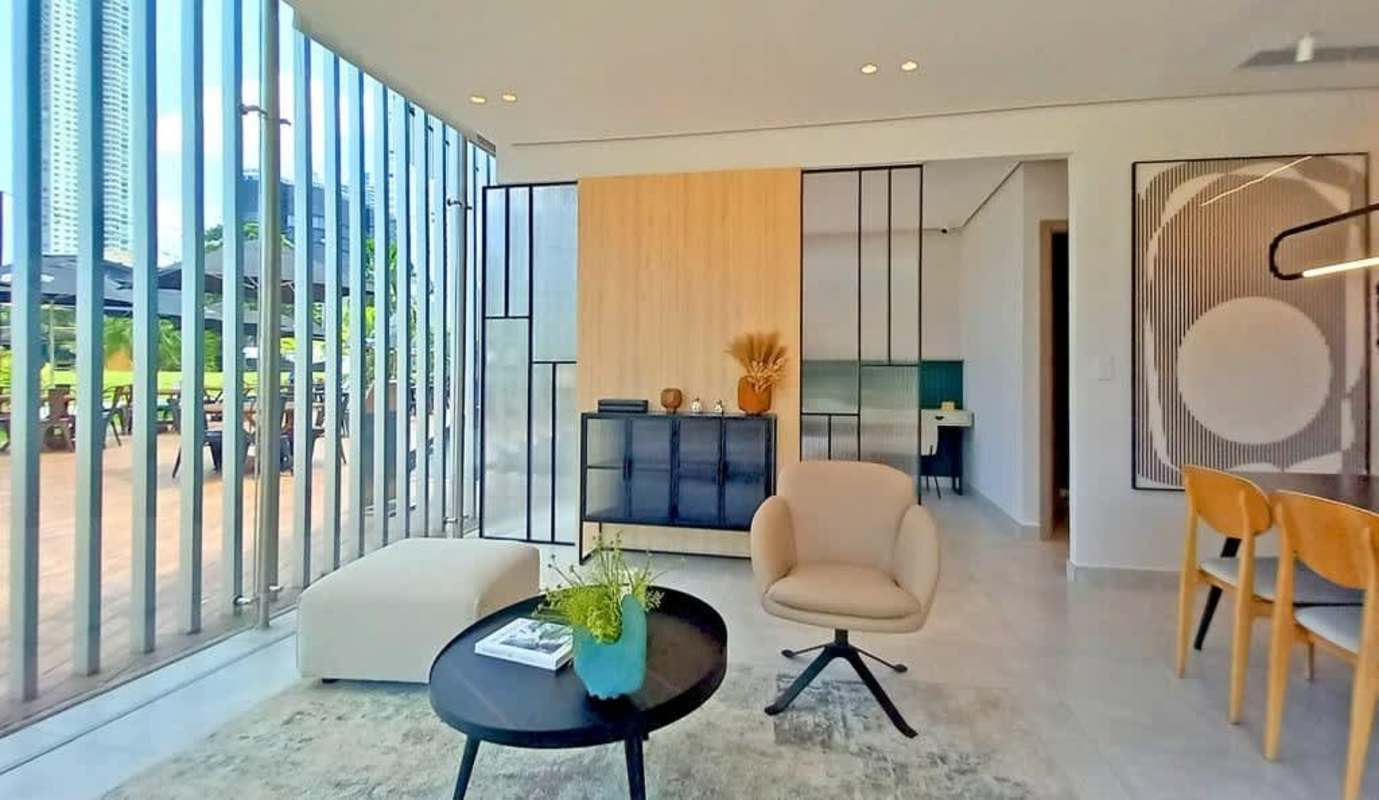 Modern furnished living area with panoramic windows at Generation Tower Costa del Este Panama