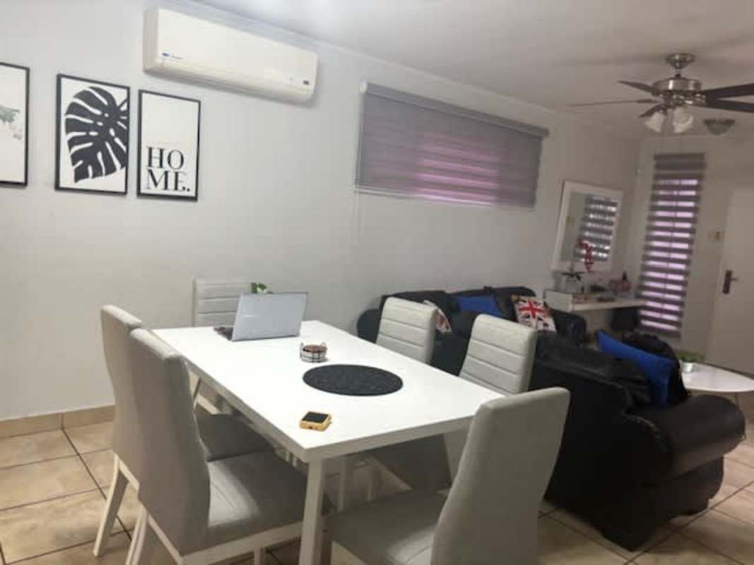 Master bedroom with ceramic tile floor, large windows in duplex home Brisas del Golf Panama