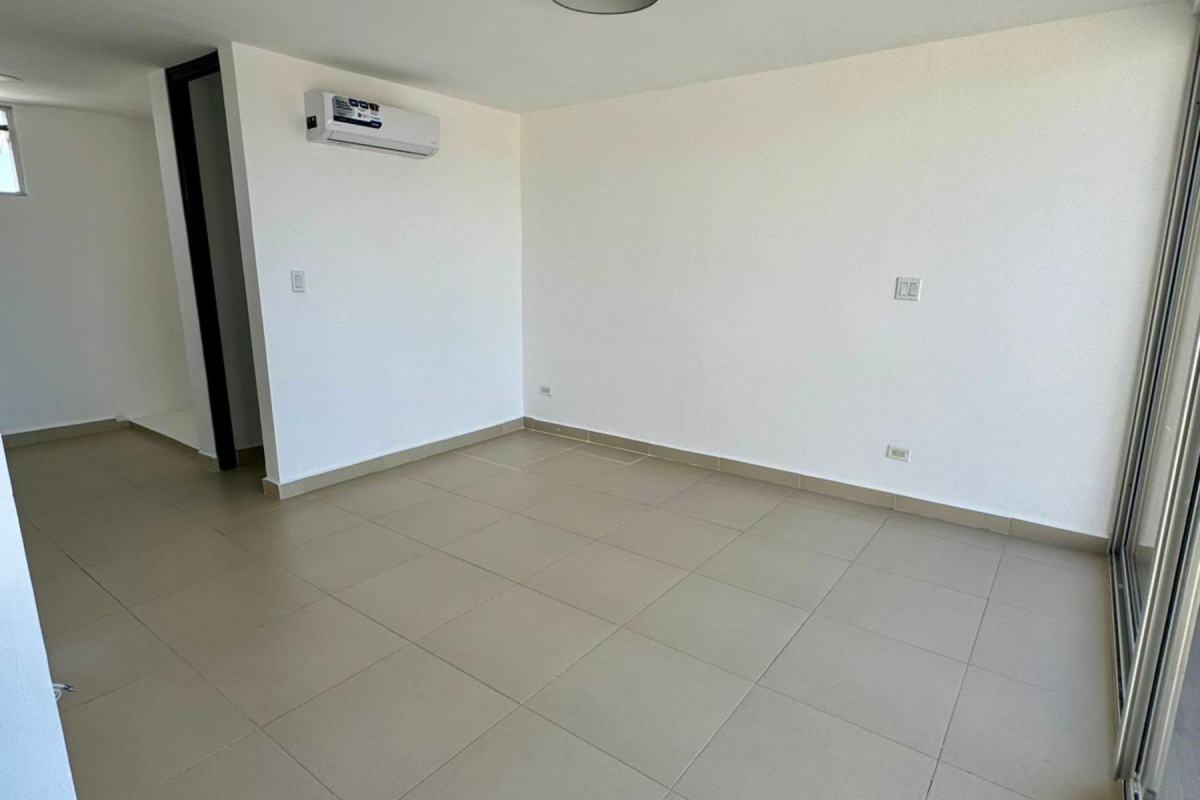 Minimalist bedroom with built-in closet, tiled floor and large window in PH Village Costa Sur Panama