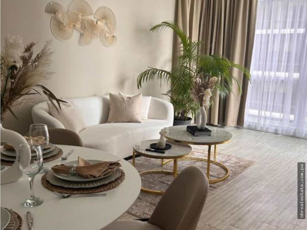 Spacious living and dining area with large window and city views at PH Quartier Atlapa San Francisco Panama