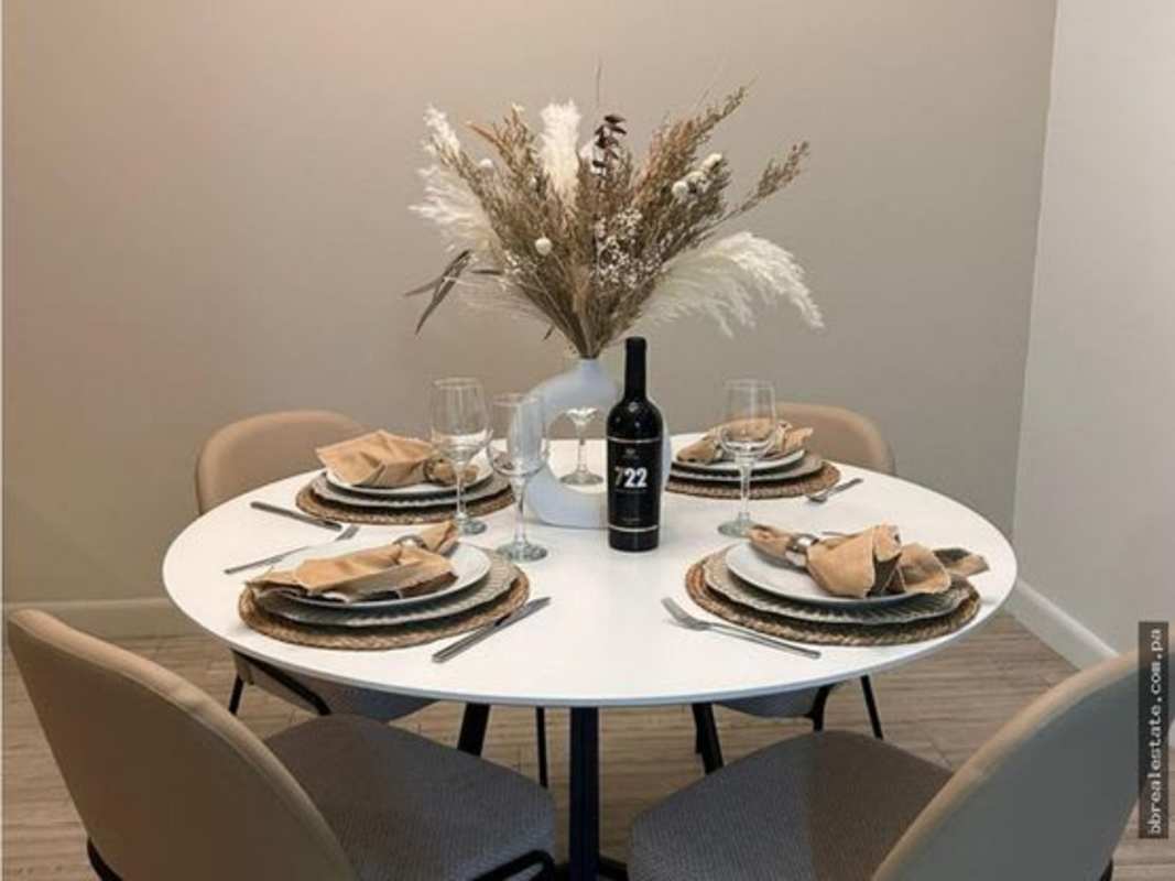 Modern kitchen featuring granite countertops, electric stove, overhead cabinets in PH Quartier Atlapa Panama City